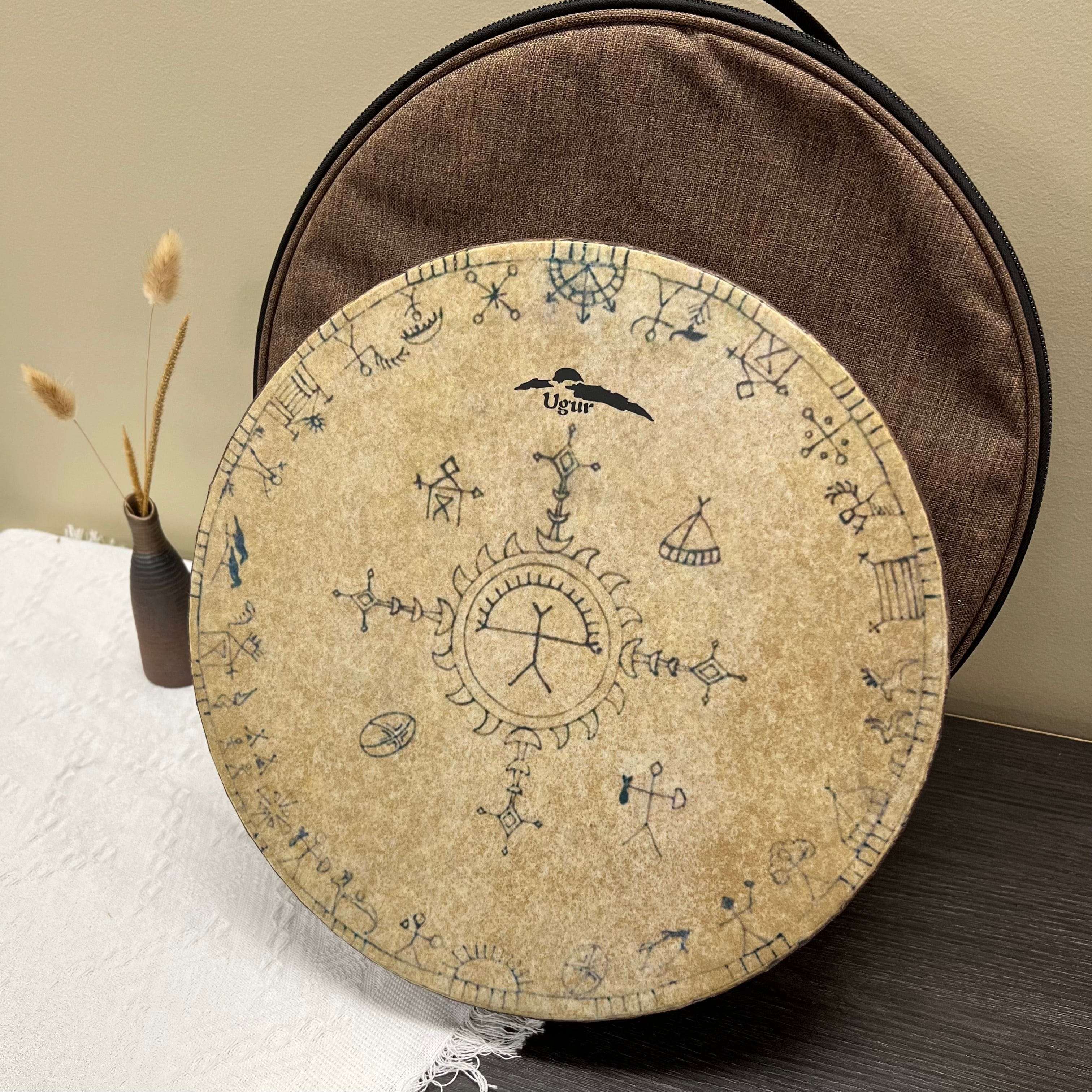 Handcrafted shamanic ocean drum with tribal symbols on natural beige skin and wooden frame.