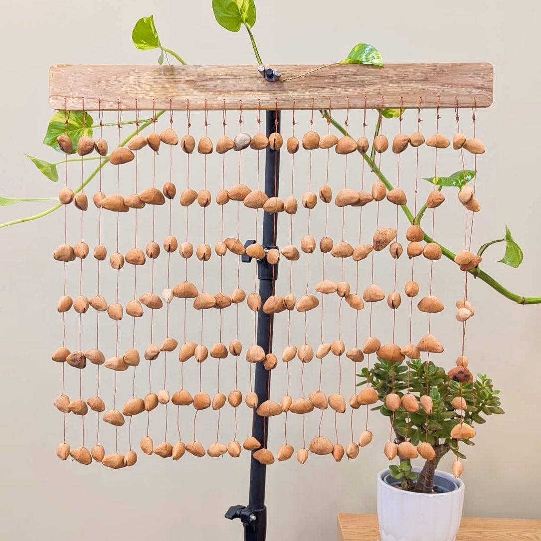 Handmade Kenari pod wind chimes from West Africa, natural sound healing decor