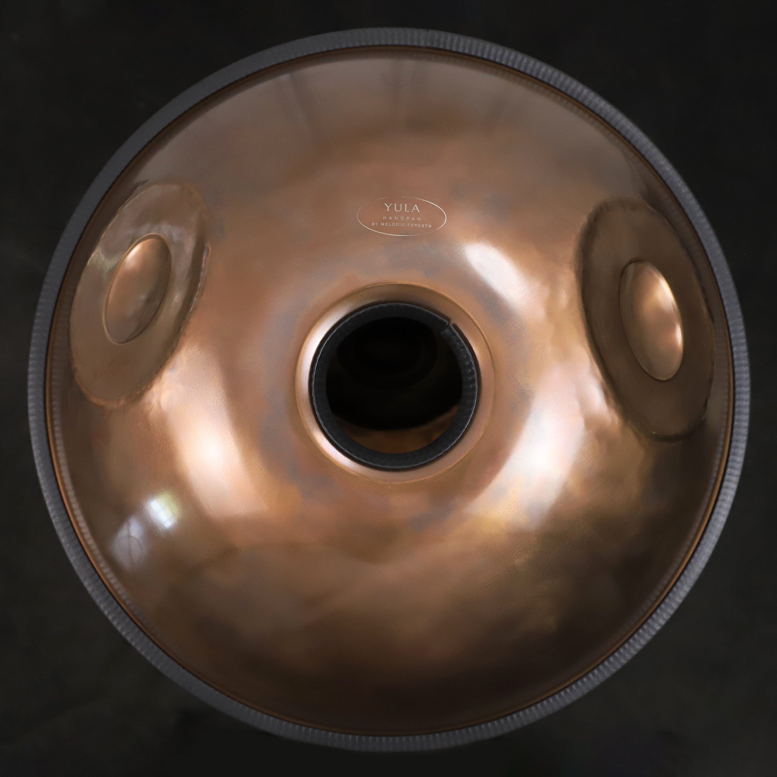 Top view of the YULA Handpan 14-Note D Kurd tuned to 432Hz, highlighting its 14-note scale for wider musical range.