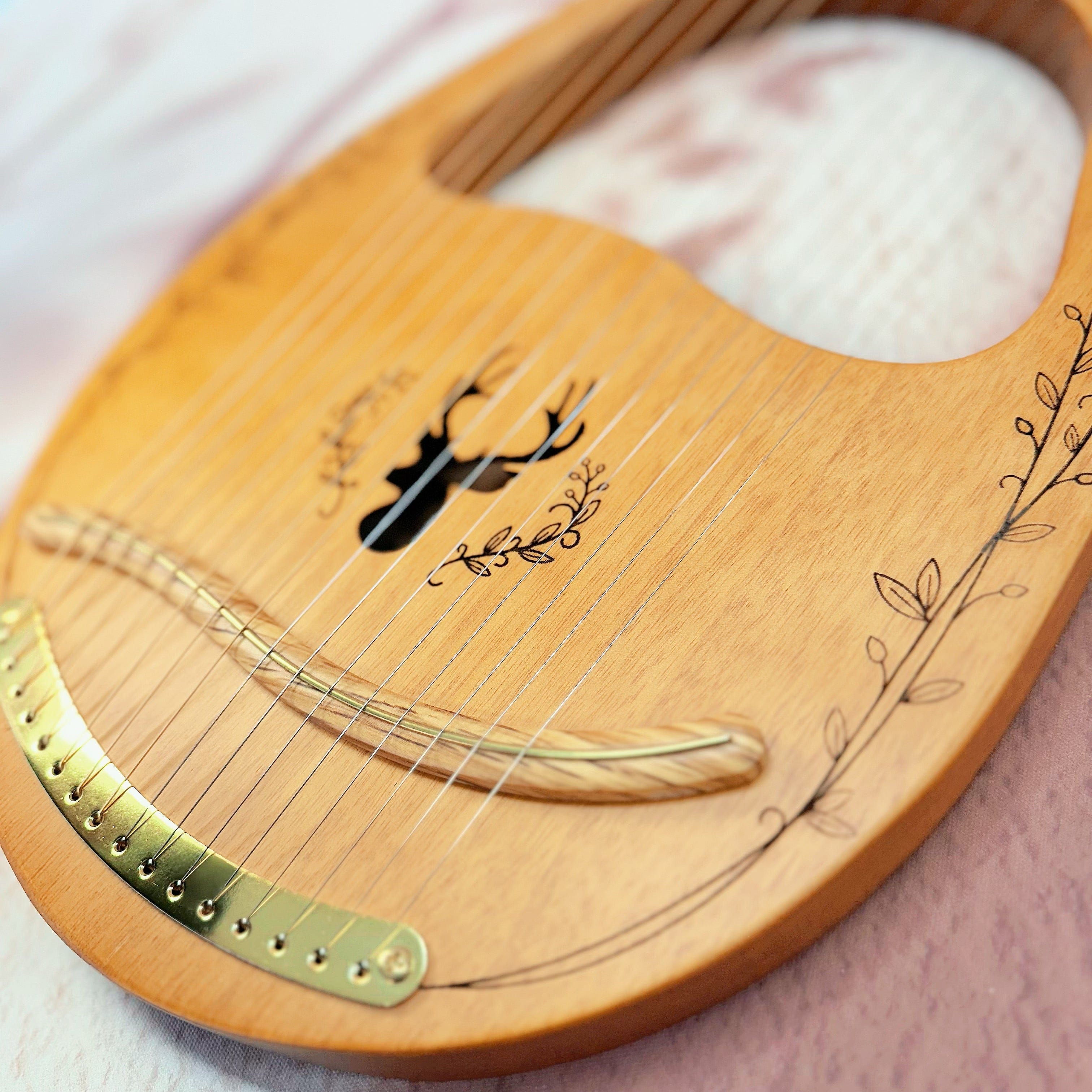 Close-up of NARA Lyre harp strings and tuning pins – handcrafted 16-string instrument for sound therapy and ritual