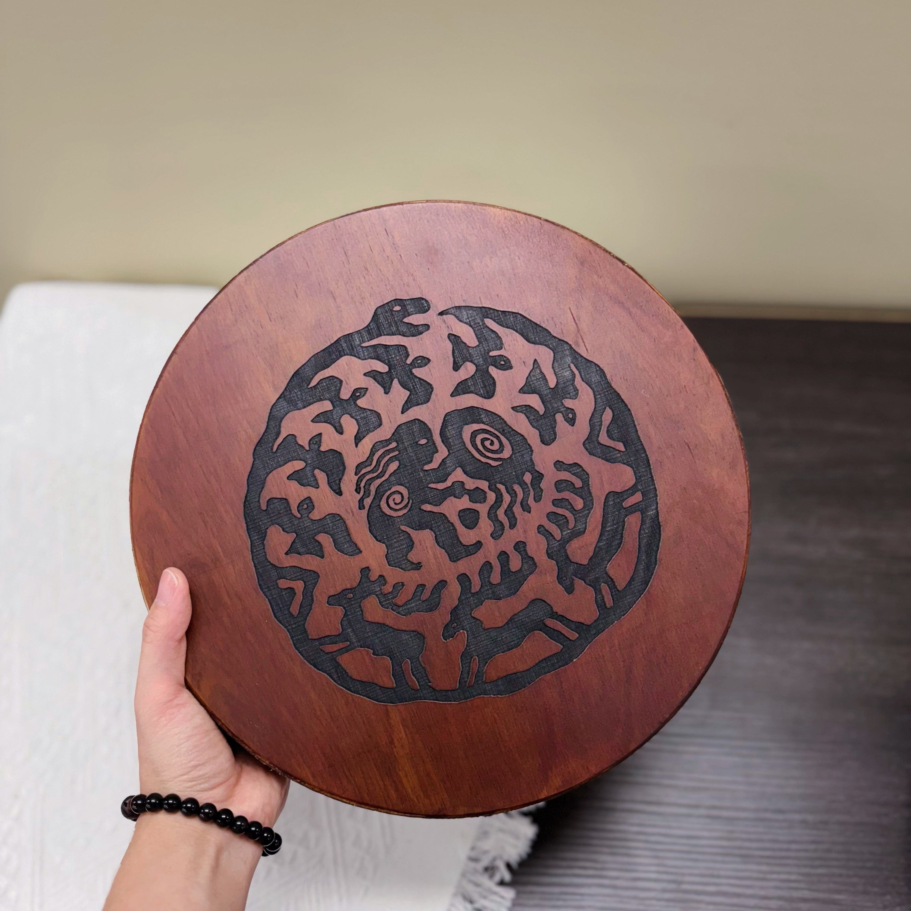 Ugur Water Drum handmade wooden sound healing drum with tribal design, also known as river or ocean drum.
