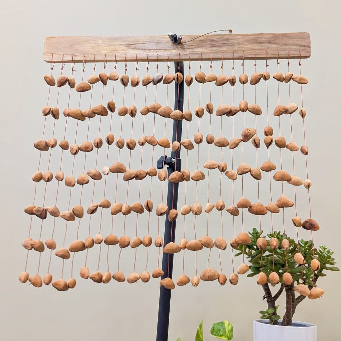 Handmade Kenari pod wind chimes from West Africa, natural sound healing decor