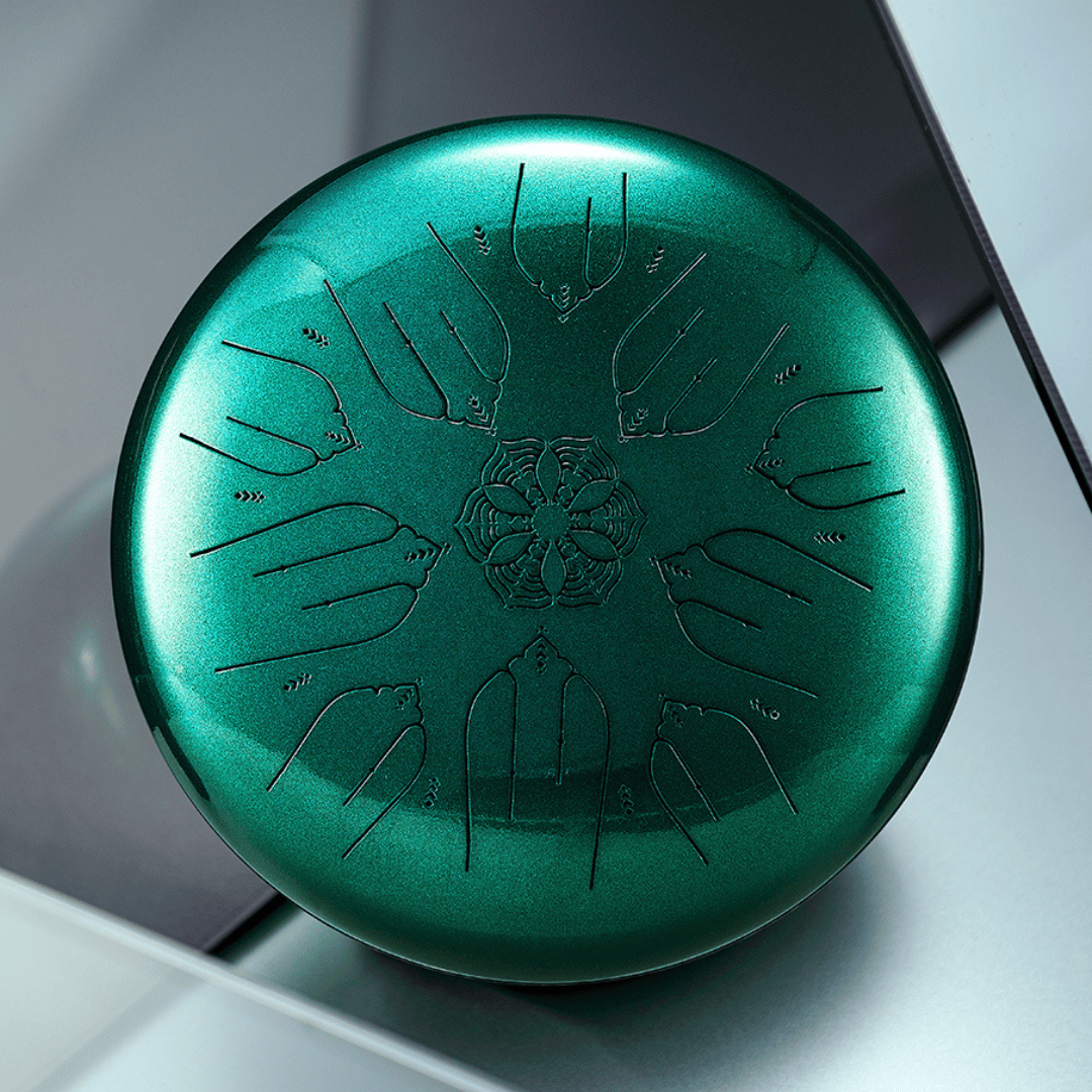 Close-up photo of Hluru EQ Ethereal Drum in emerald green, highlighting 10-note design and flower engraving at the center.