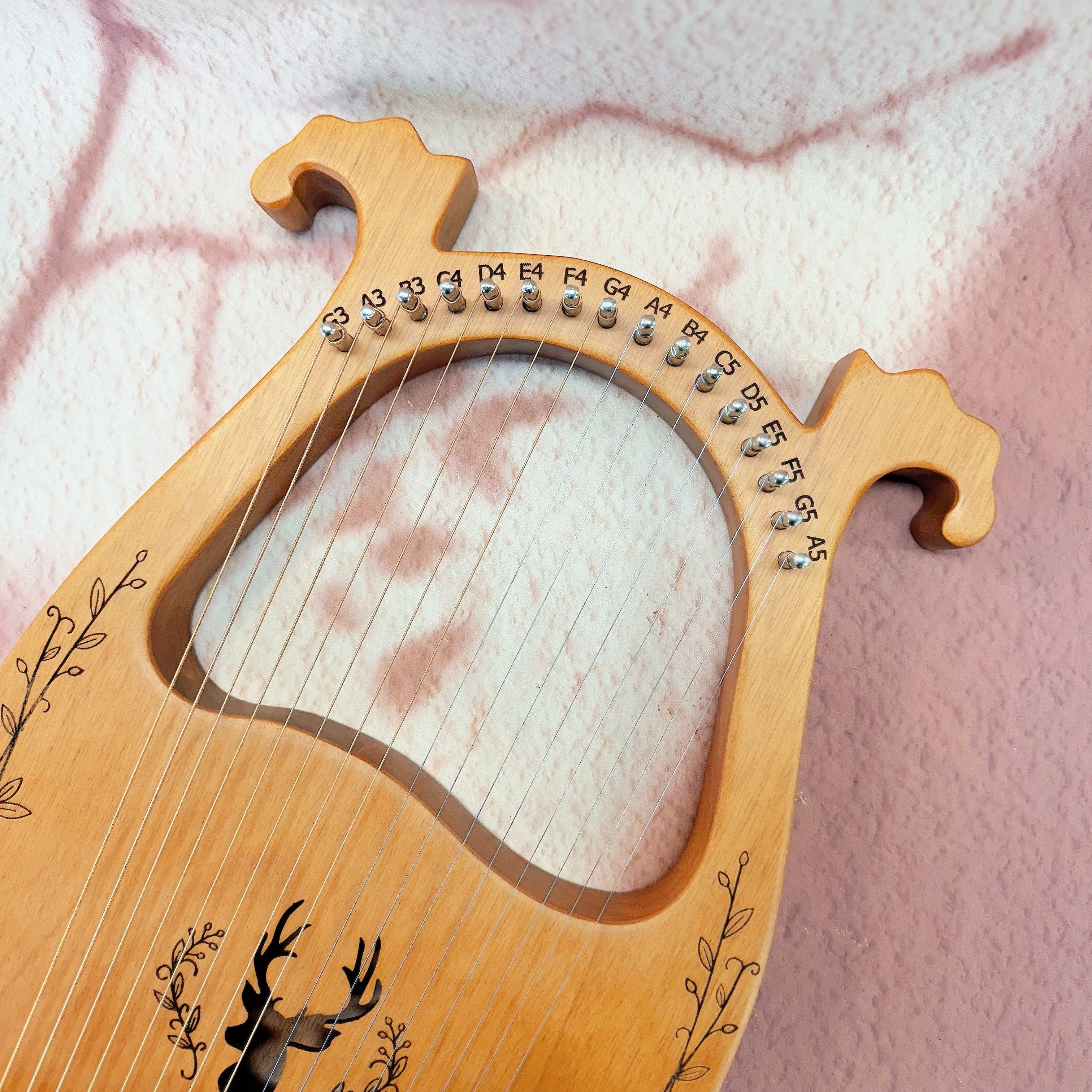 Close-up of NARA Lyre harp strings and tuning pins – handcrafted 16-string instrument for sound therapy and ritual