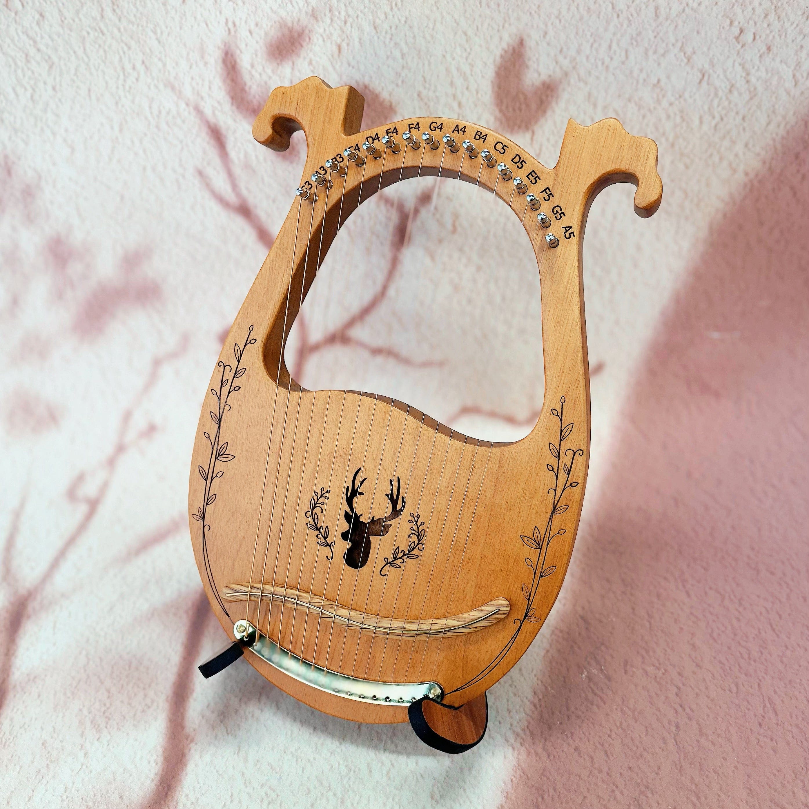 Close-up of NARA Lyre harp strings and tuning pins – handcrafted 16-string instrument for sound therapy and ritual